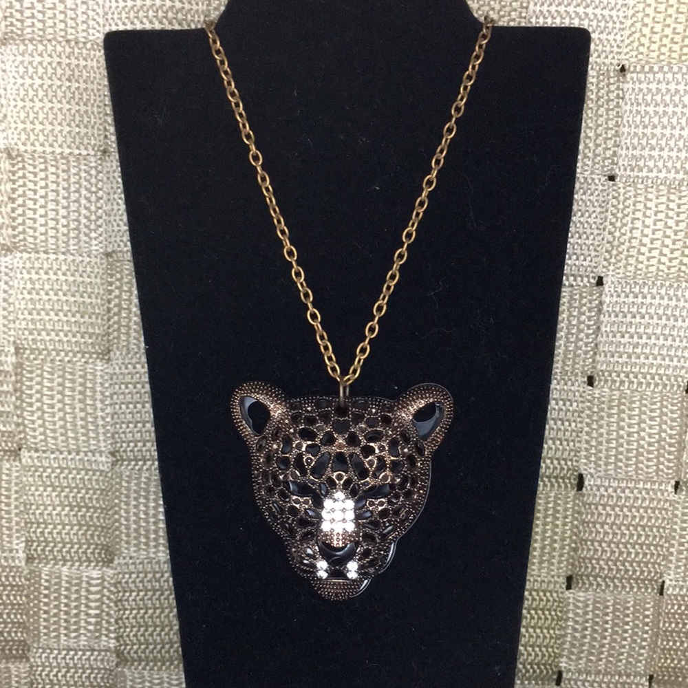 Leopard face necklace.